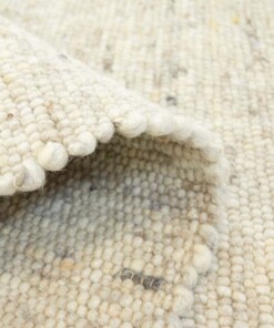 Tapis en laine tissé main Ylva - beige - close up vouw, thumbnail Tapis en laine tissé main Ylva - beige - close up vouw, thumbnail