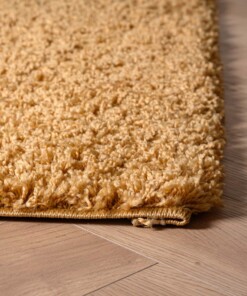 Tapis Carré poils longs Shaggy Trend - or - close up hoek