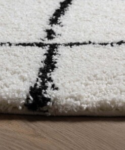 Tapis poils longs Rond losange Artisan - blanc/noir - close up zijkant, thumbnail Tapis poils longs Rond losange Artisan - blanc/noir - close up zijkant, thumbnail