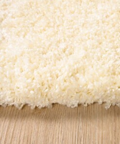 Tapis poils longs Carré - Shaggy Grand Crème - close up zijkant, thumbnail Tapis poils longs Carré - Shaggy Grand Crème - close up zijkant, thumbnail