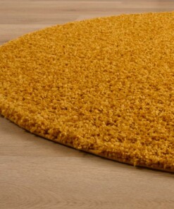 Tapis ovale poils longs - Shaggy Trend jaune moutarde - close up zijkant, thumbnail