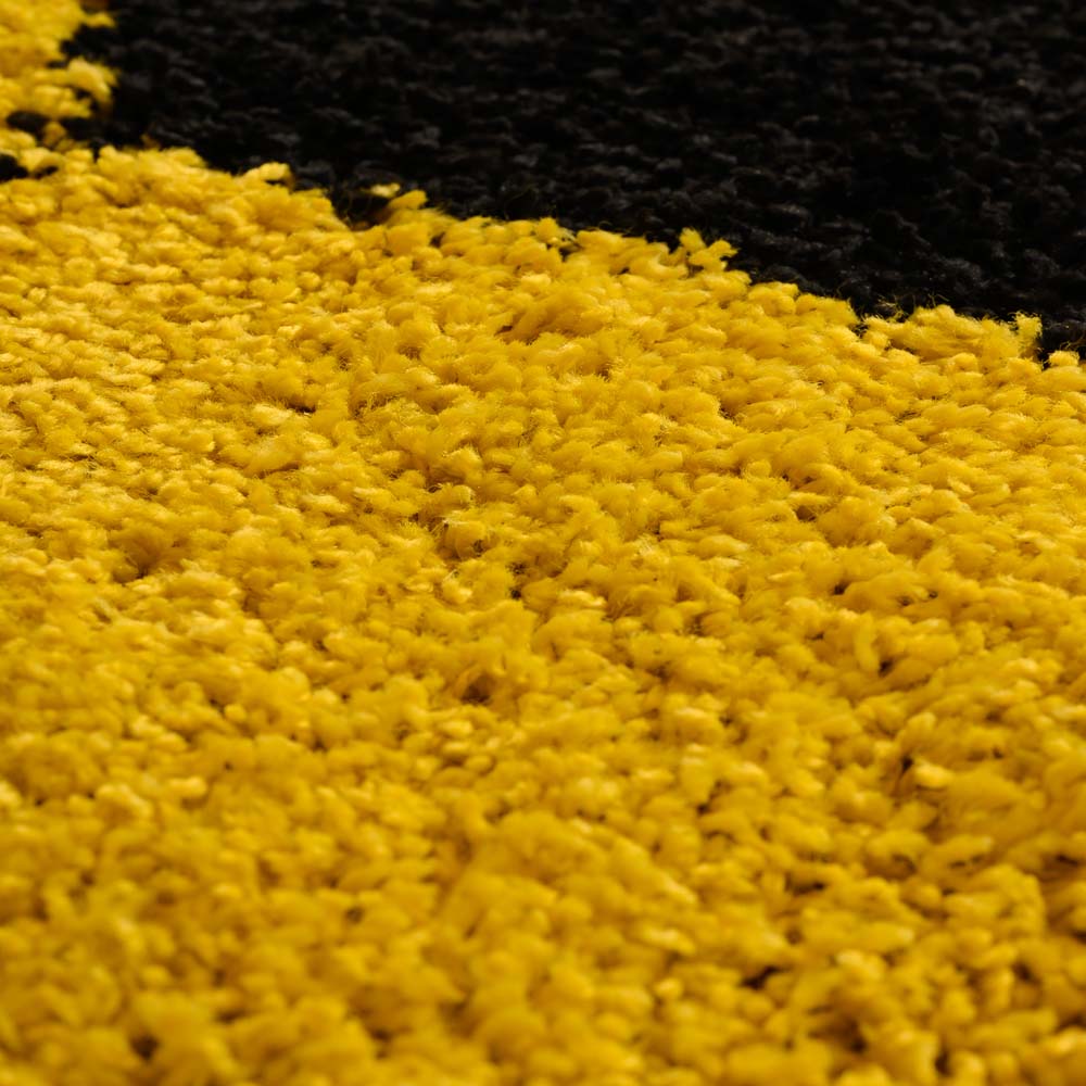 Tapis football rond - Sports jaune/noir - close up Tapis football rond - Sports jaune/noir - close up