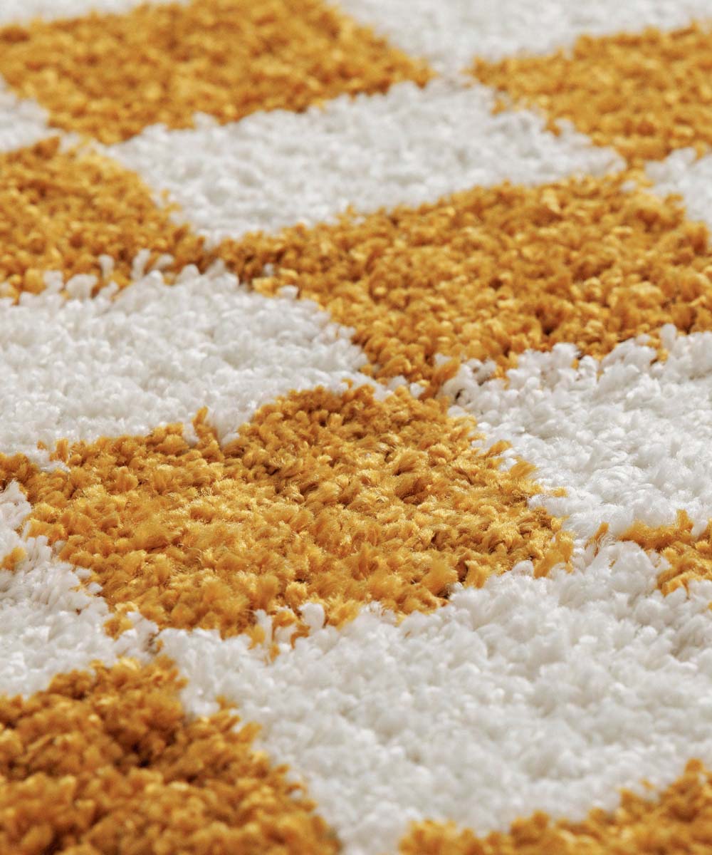 Tapis rond rétro - Check ivoire/or - close up Tapis rond rétro - Check ivoire/or - close up