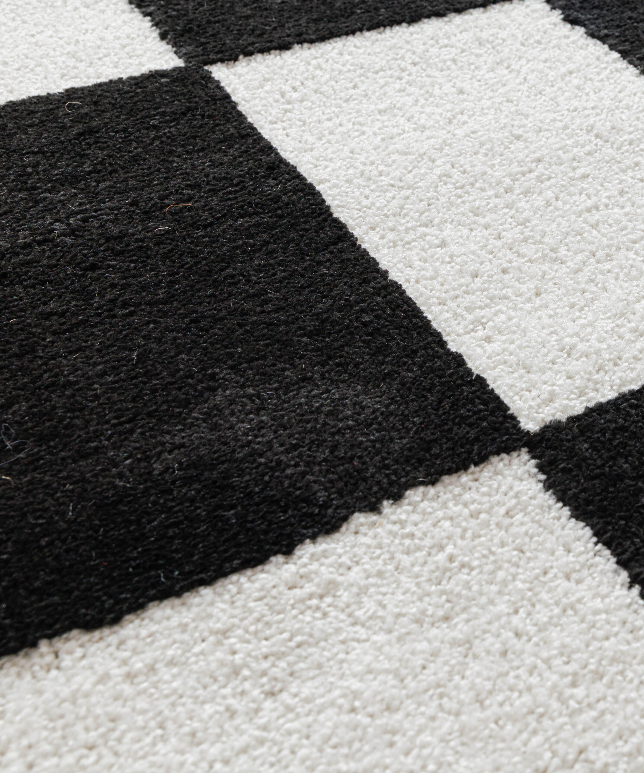 Tapis damier - Nivo Maeve blanc/noir - close up Tapis damier - Nivo Maeve blanc/noir - close up