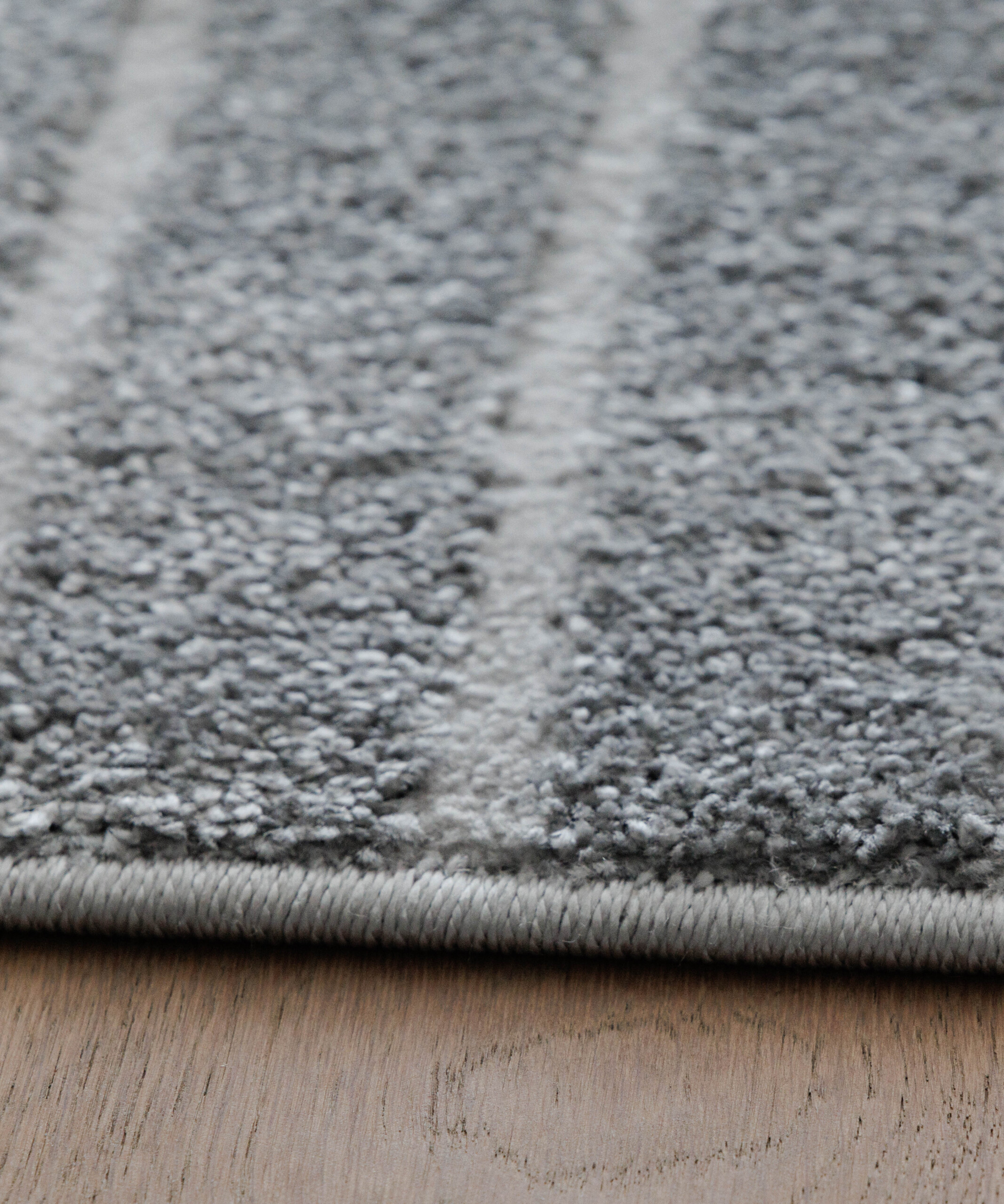 Tapis scandinave - Contour Edge gris - close up Tapis scandinave - Contour Edge gris - close up