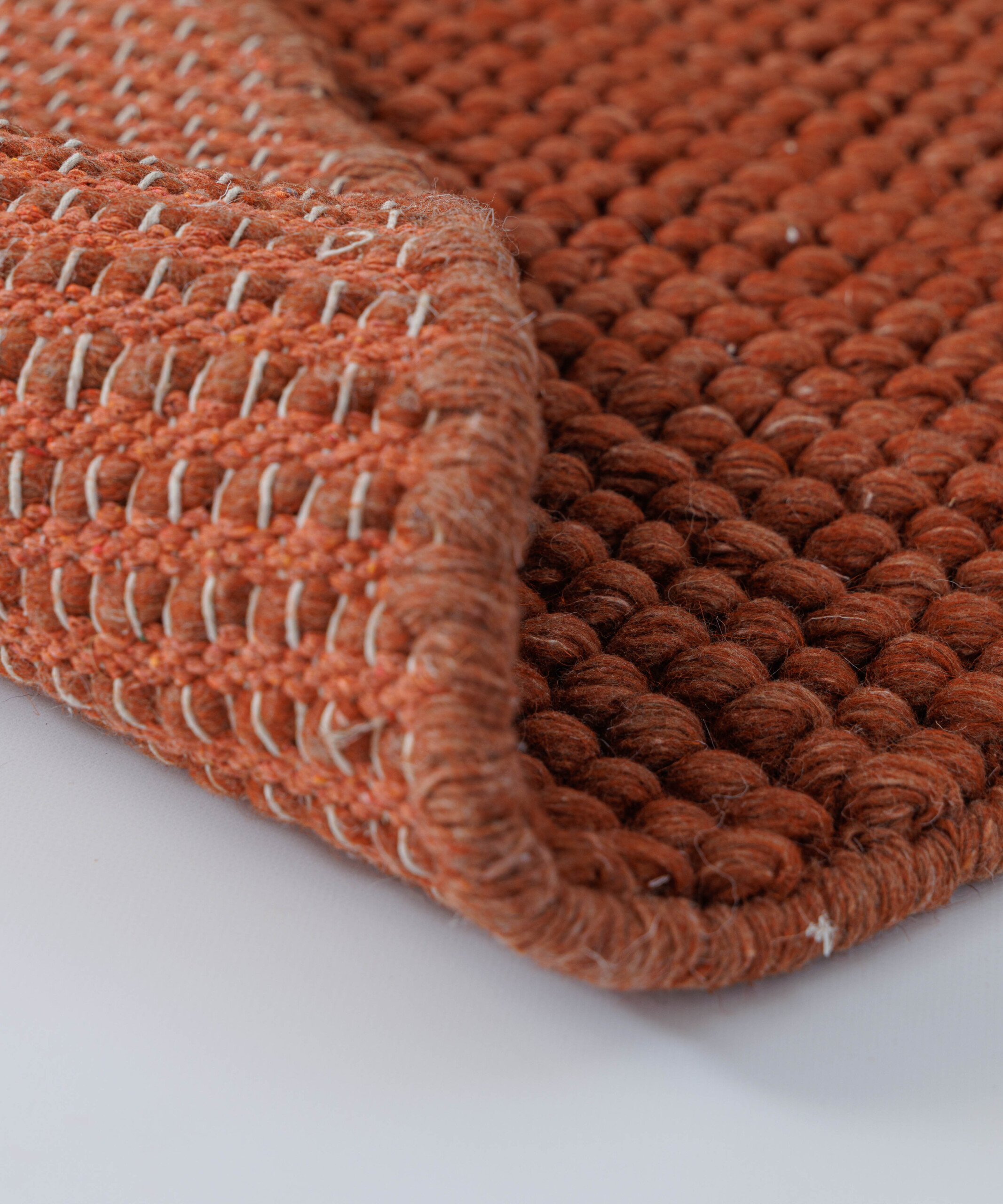 Tapis laine rond - Fjell terre cuite - close up Tapis laine rond - Fjell terre cuite - close up