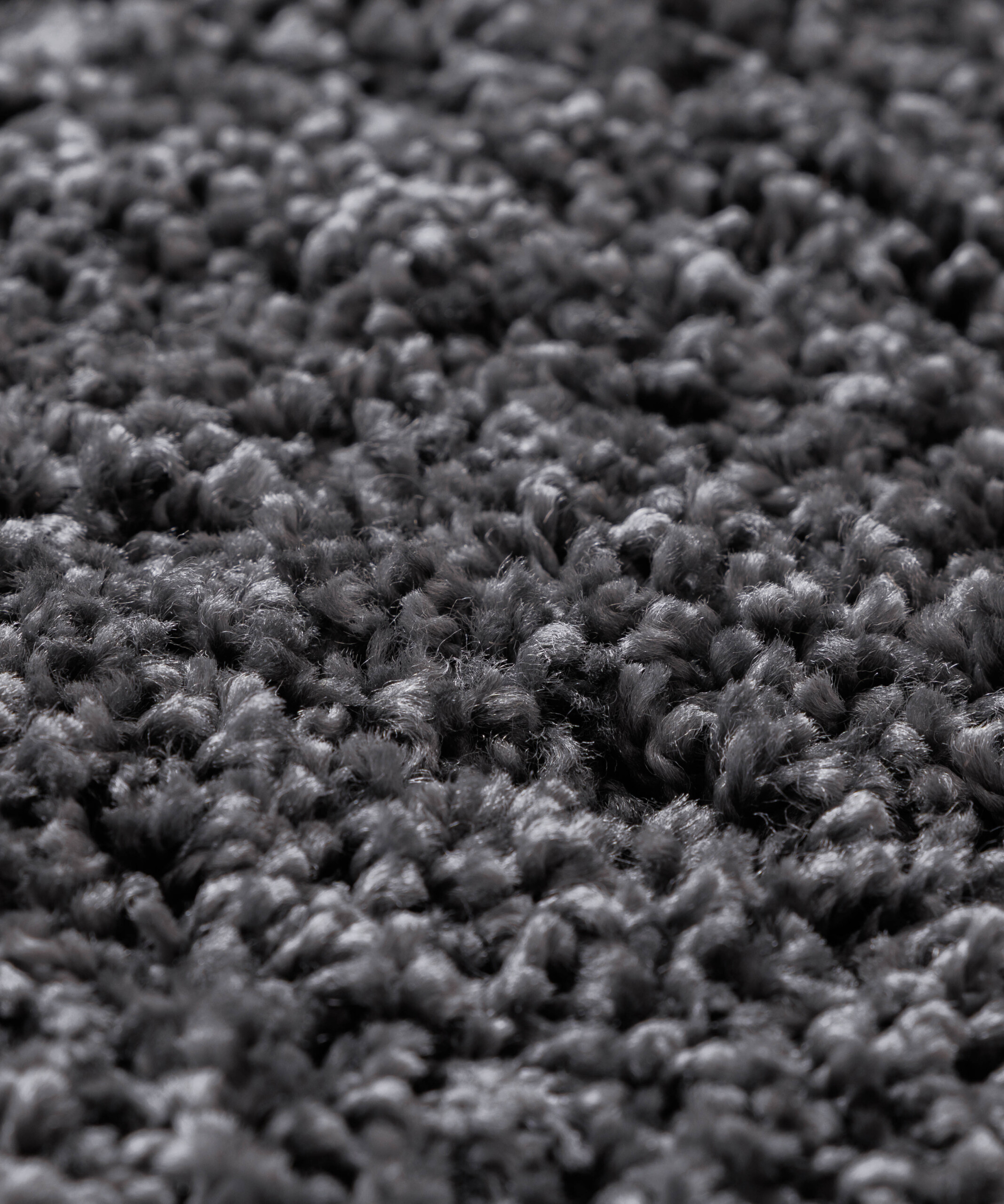 Tapis Rond poils longs Shaggy Grand - gris foncé - close up Tapis Rond poils longs Shaggy Grand - gris foncé - close up