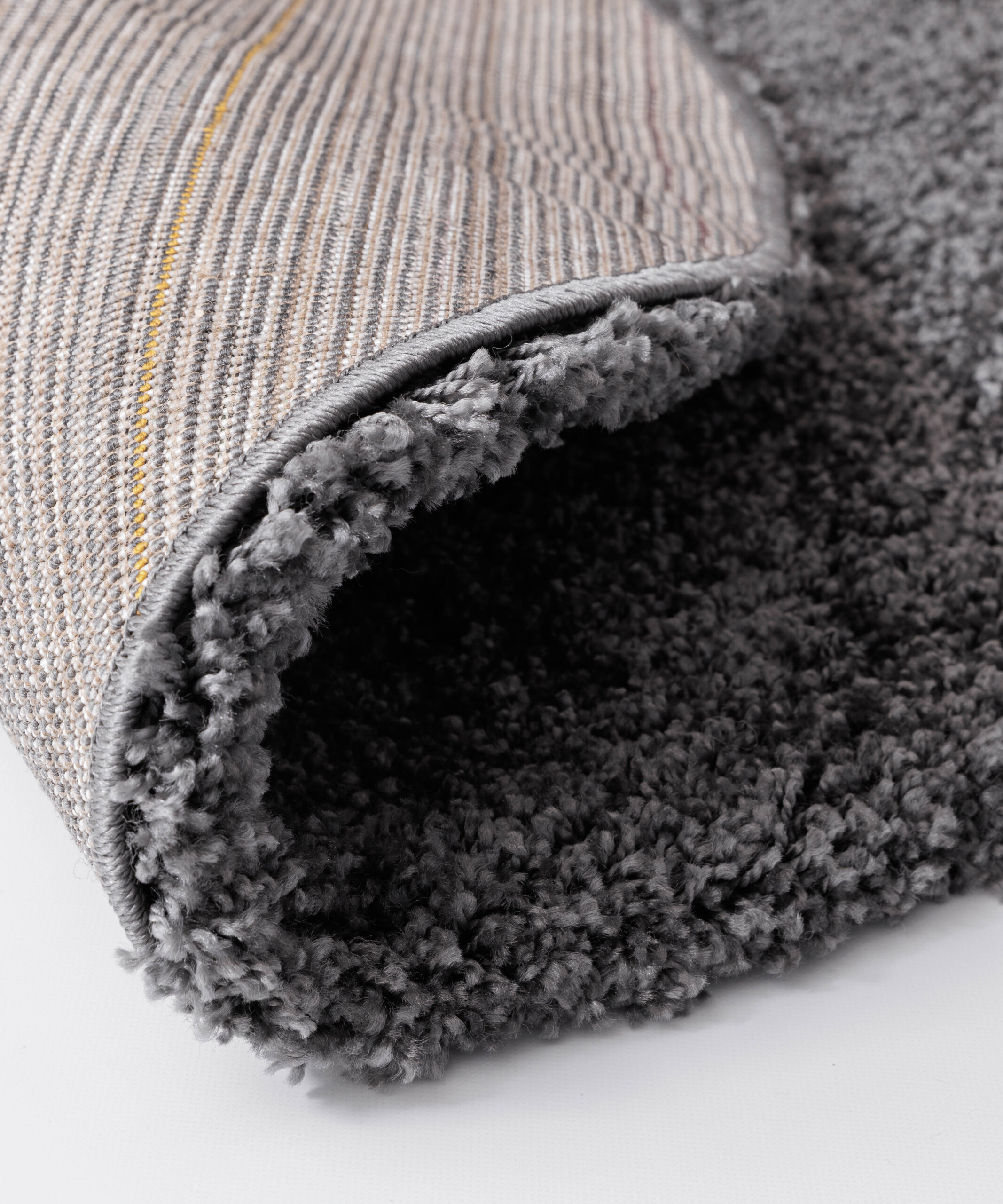 Tapis Rond poils longs Shaggy Grand - gris foncé - close up Tapis Rond poils longs Shaggy Grand - gris foncé - close up