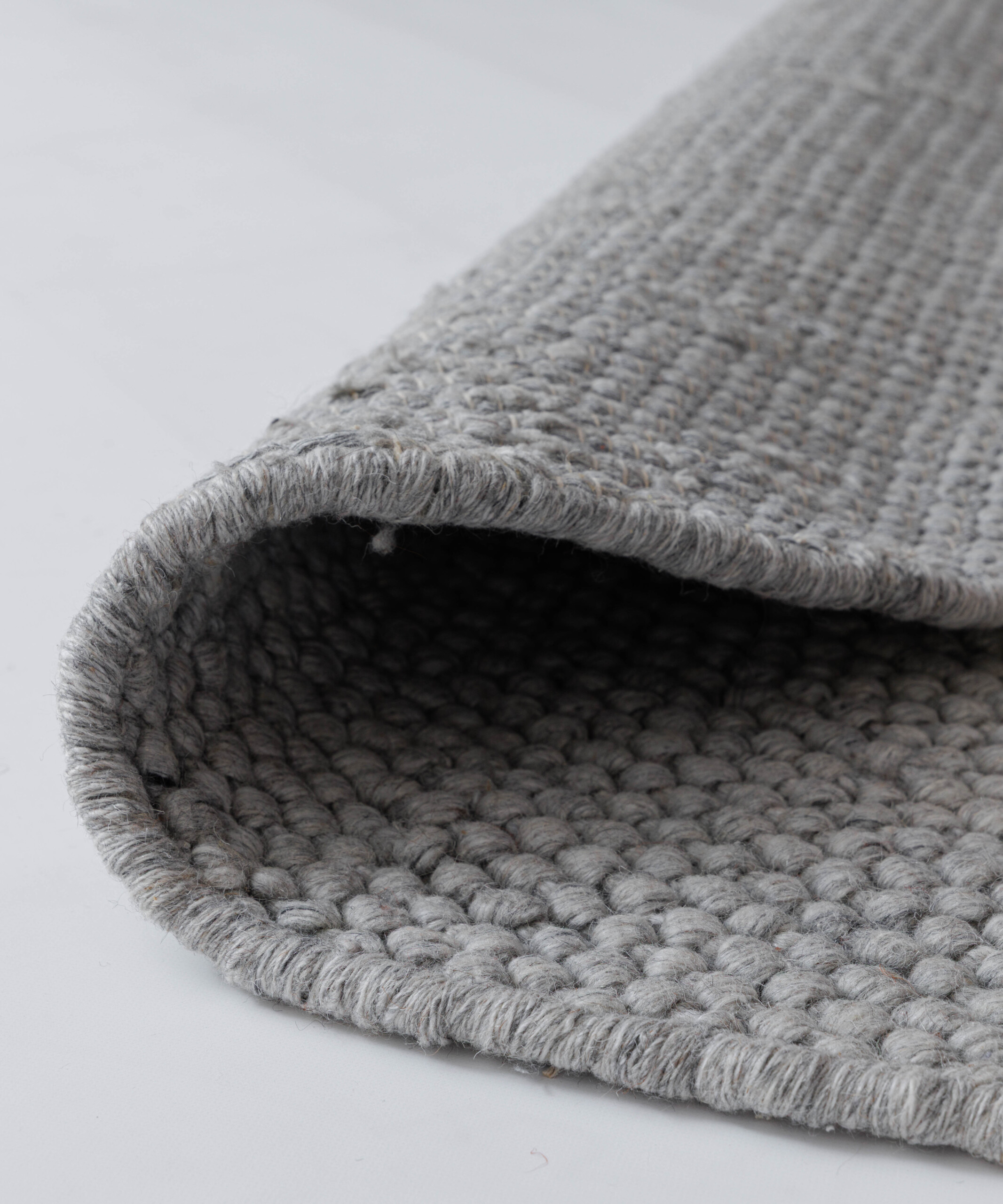 Tapis laine rond - Løkke gris clair - close up Tapis laine rond - Løkke gris clair - close up